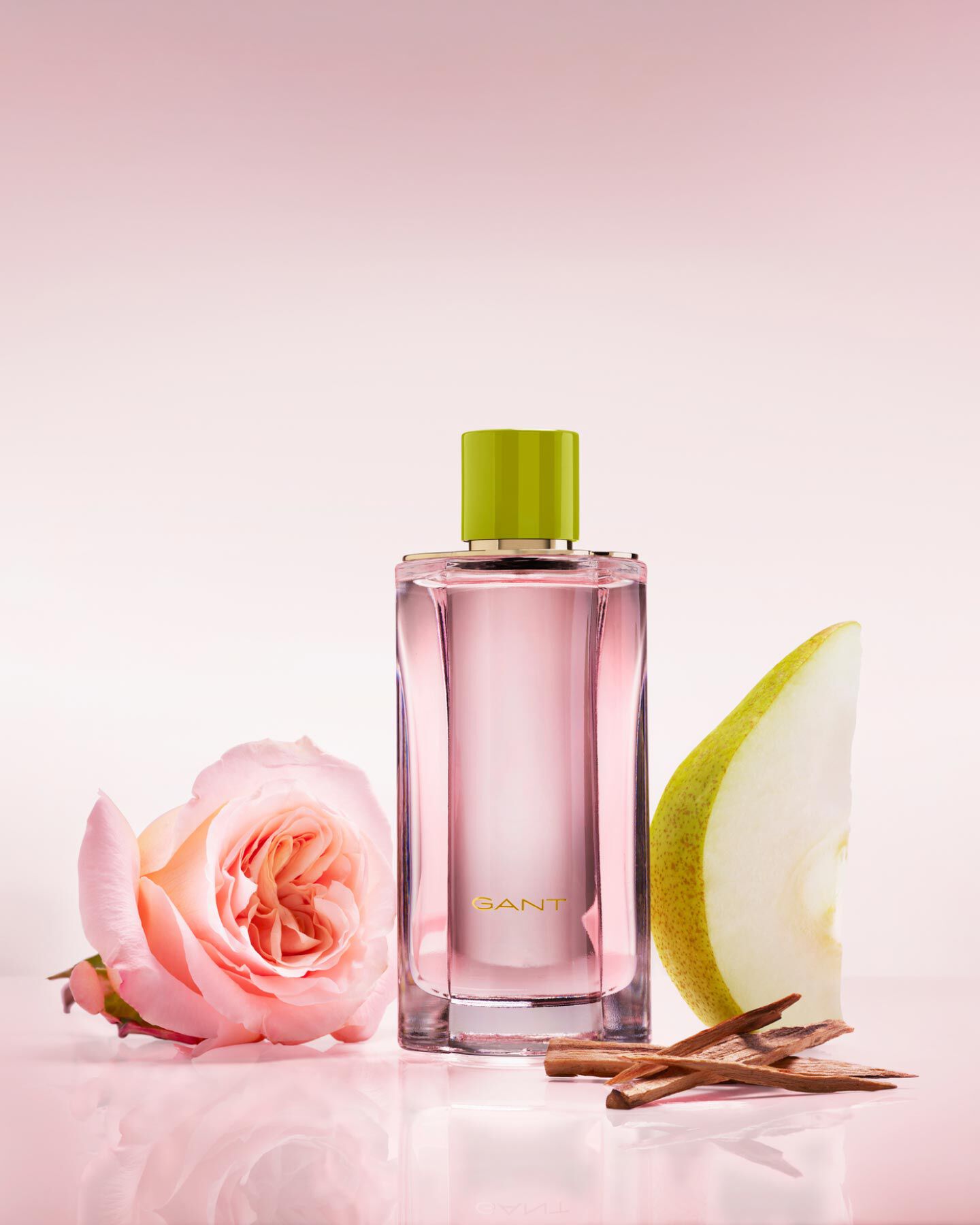 A pink bottle of Gant women's fragrance together with rose, pear and cedarwood.