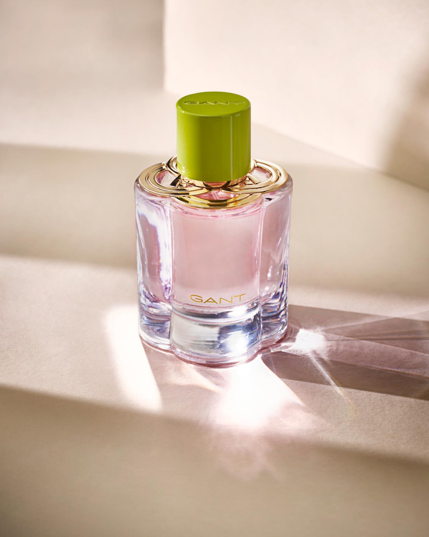A pink bottle of GANT women's fragrance preppy rose