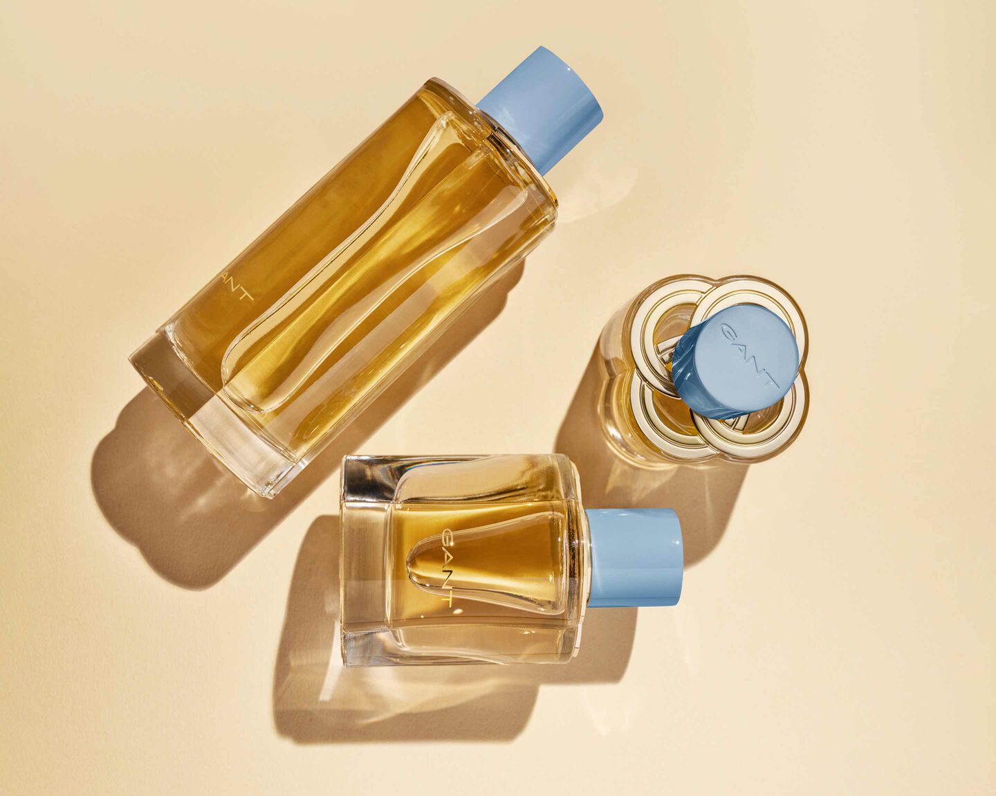 Three yellow bottles of Gant Sunset Club Fragrance