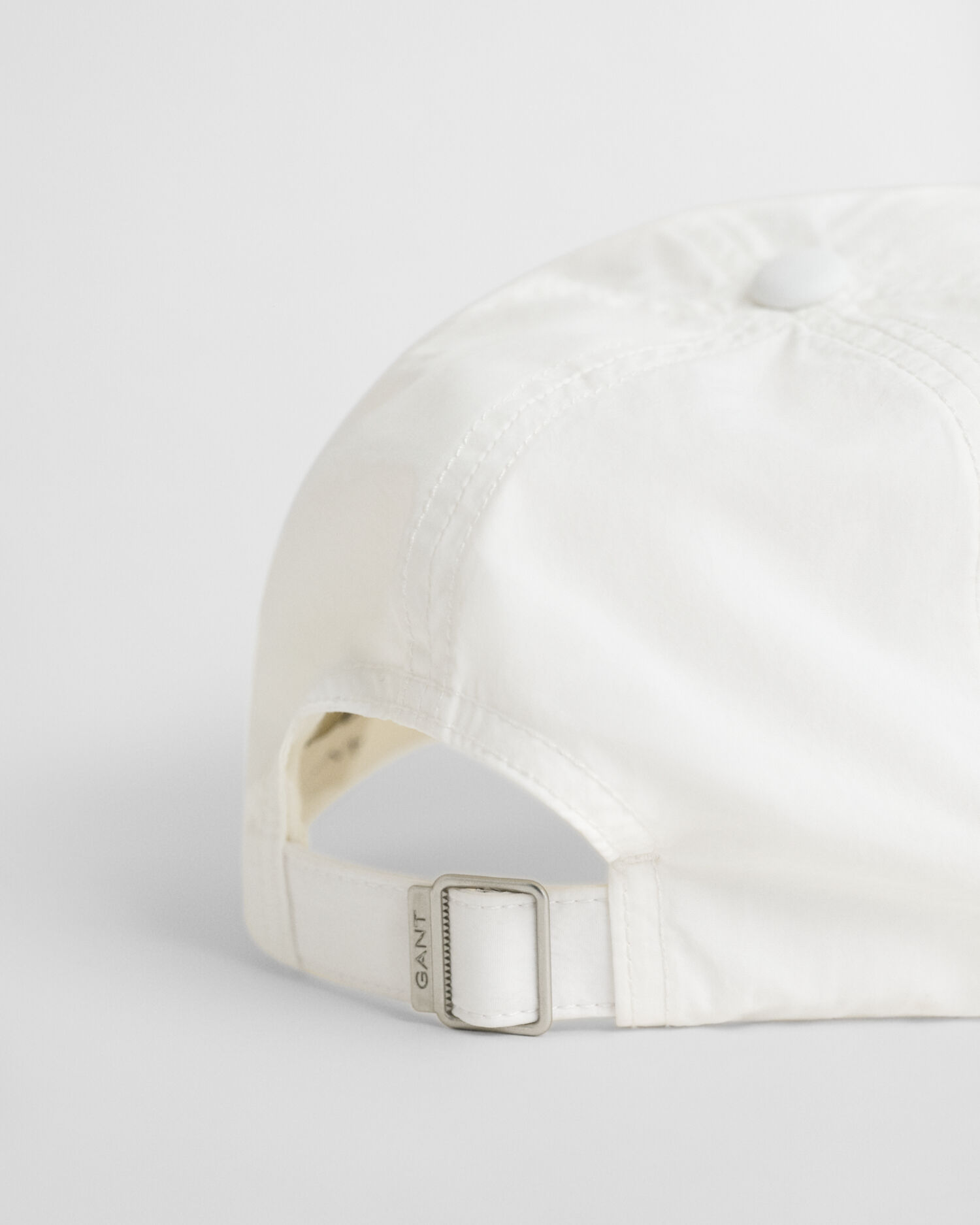 Cap in Crinkle-Optik mit kleiner Grafik